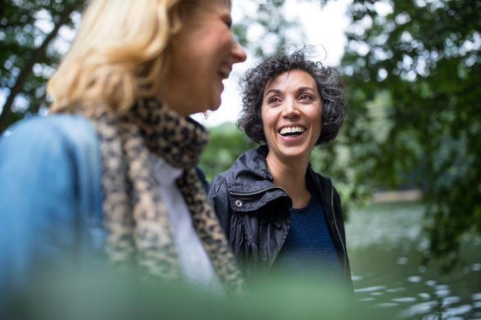 Women laughing, friends, outside, walking